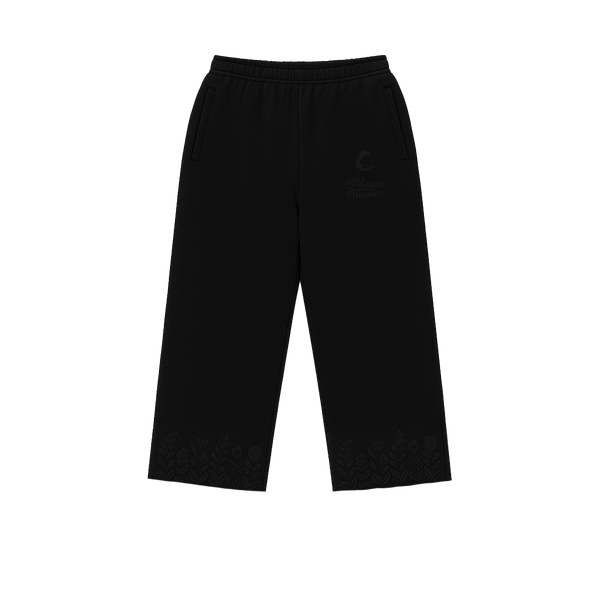 Black floral track pants with embroidered details