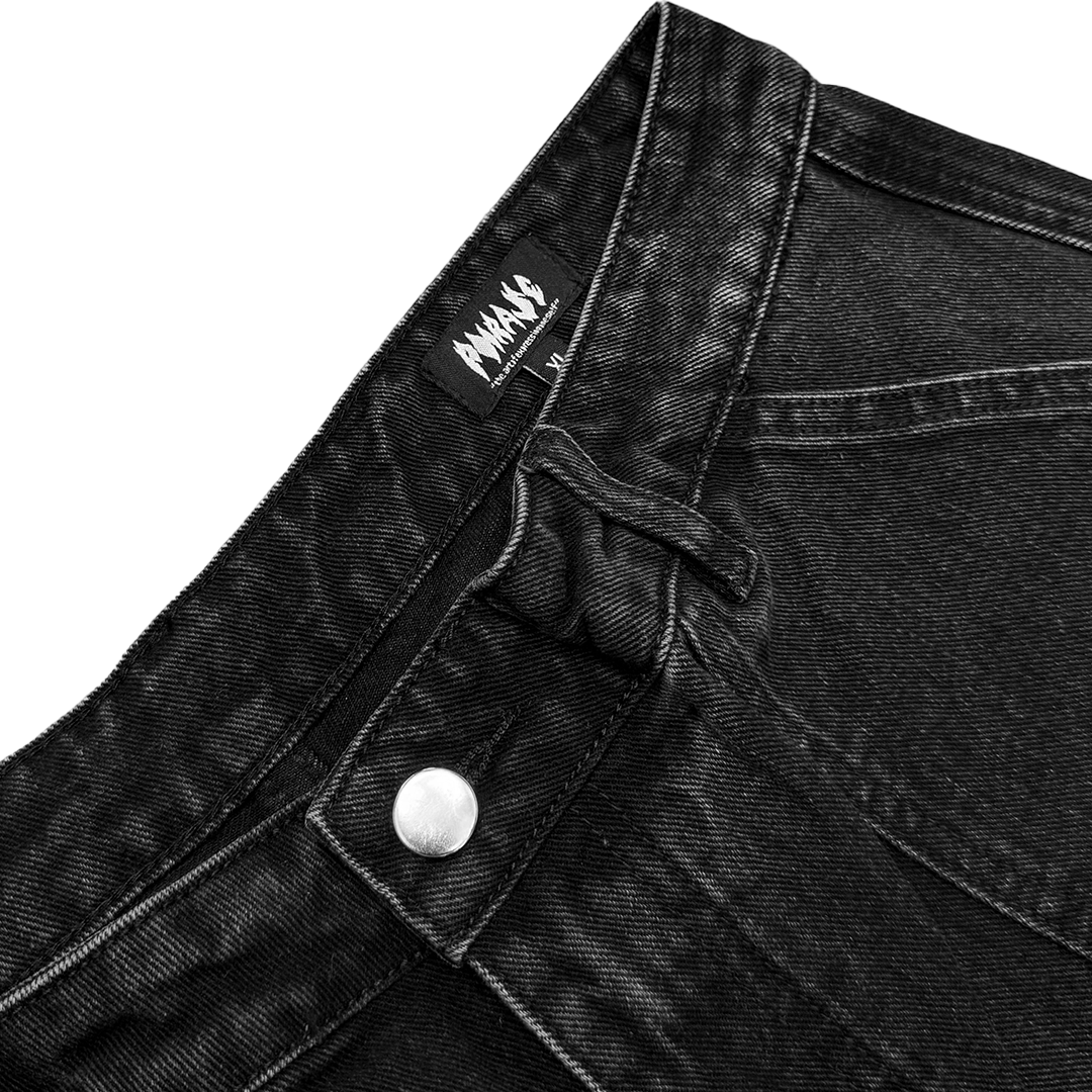 Model wearing black distressed jeans