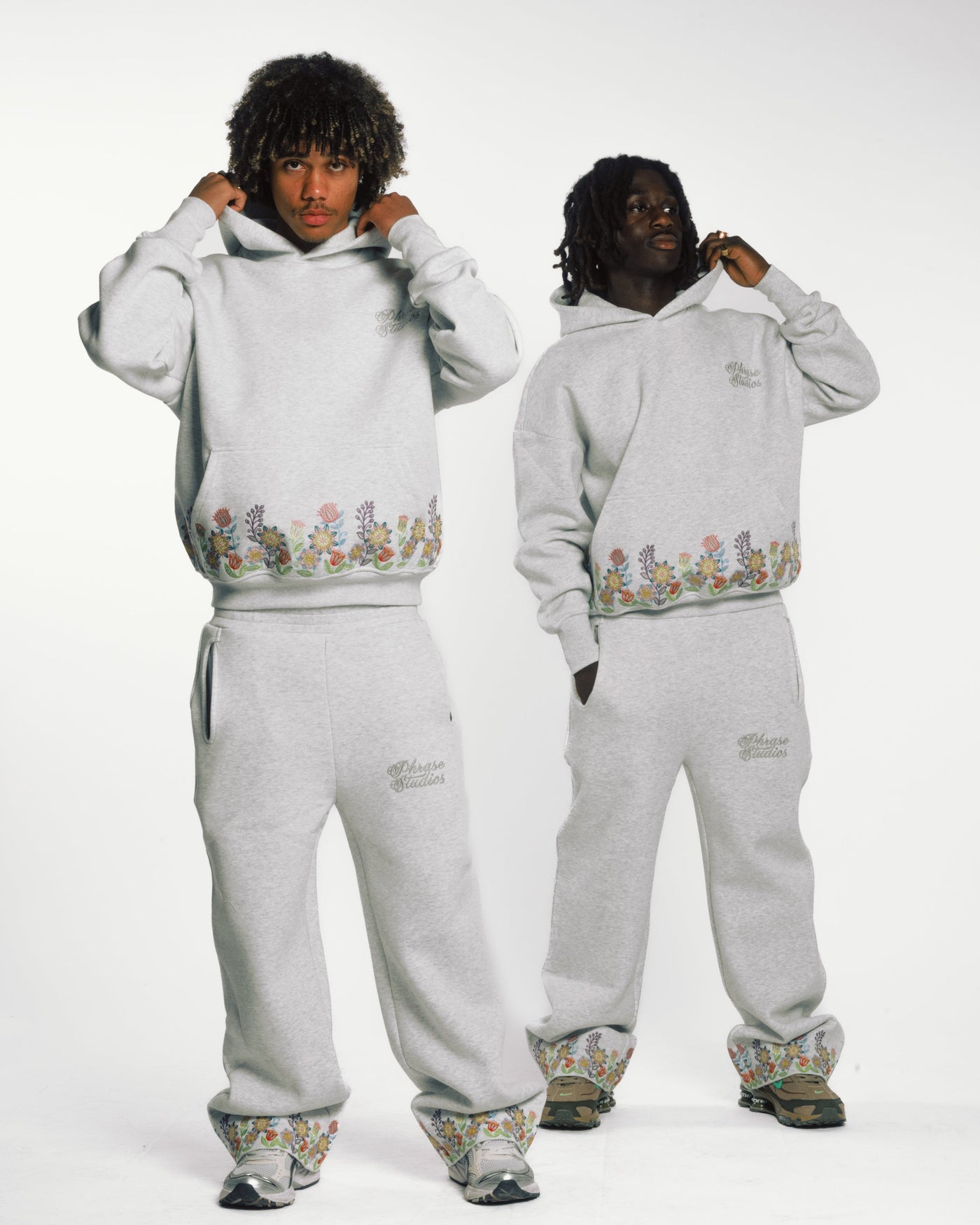 Friends wearing Floral Bloom, all-over floral embroidery on heavyweight unisex cotton.
