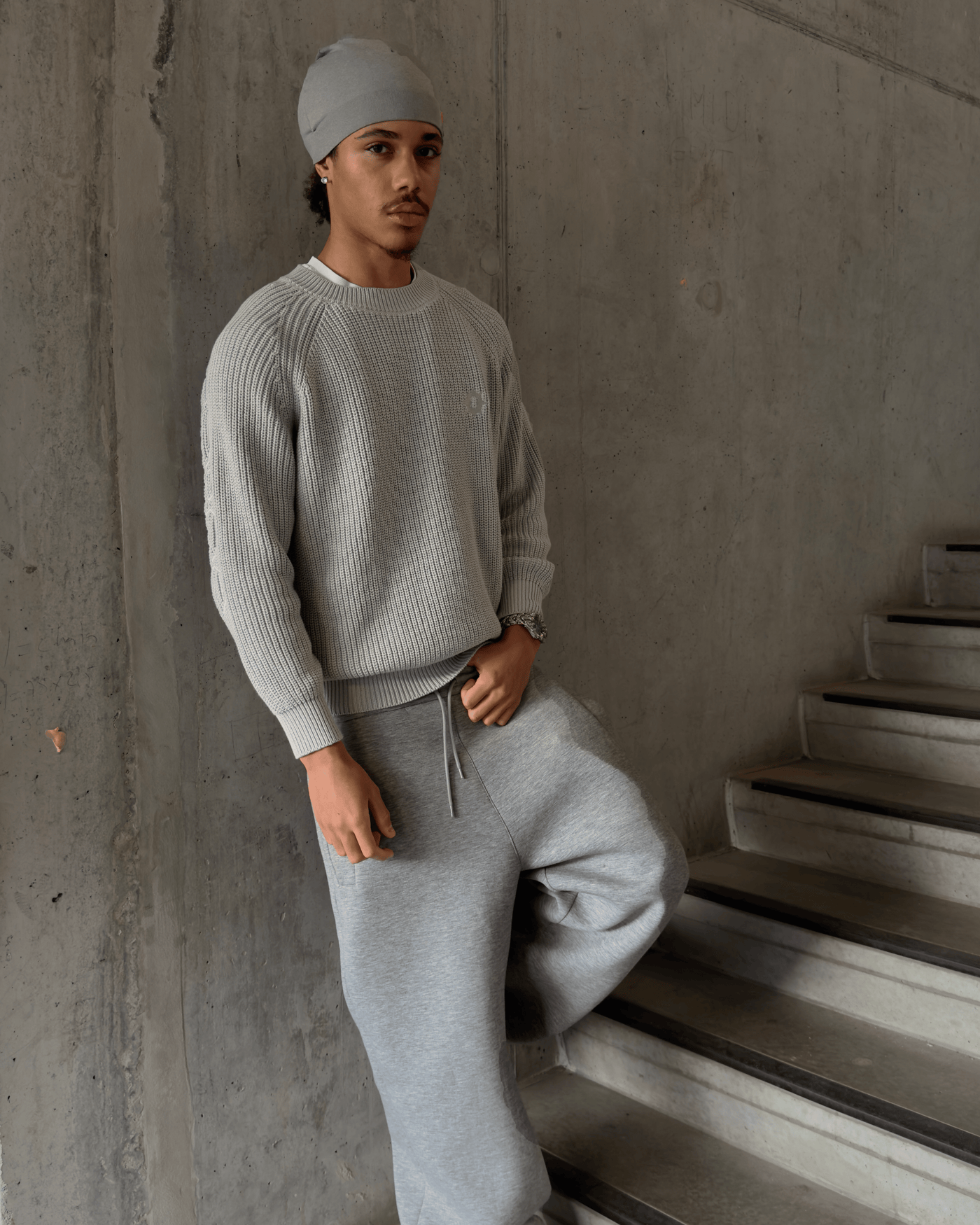 Gray Horizon Knit sweater with embossed text for apparel and clothing tops